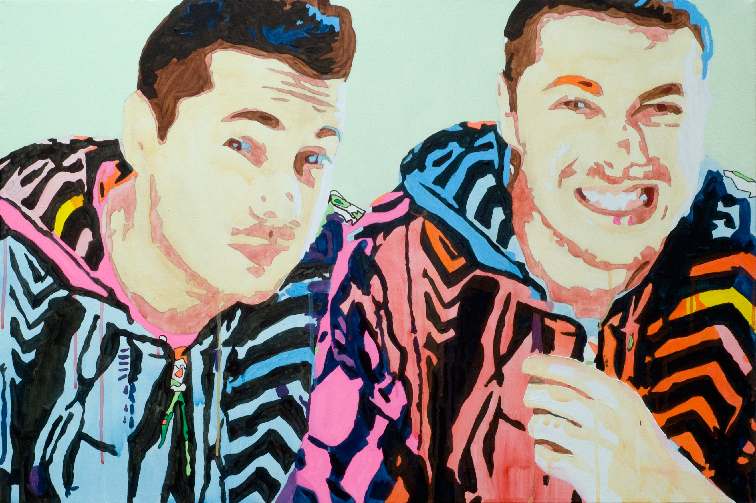 Two smiling portraits of a man in brightly patterned hooded jackets against a pale mint background.