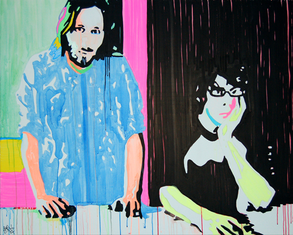 Two musicians stand behind stage equipment, one in pale blue and one in black, divided by a dark field streaked with pink.
