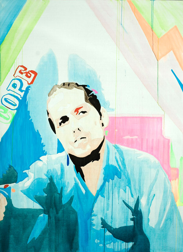 A seated man in loose blue clothing leans forward against a nearly white field of pale cyan, pink, and green stage marks.