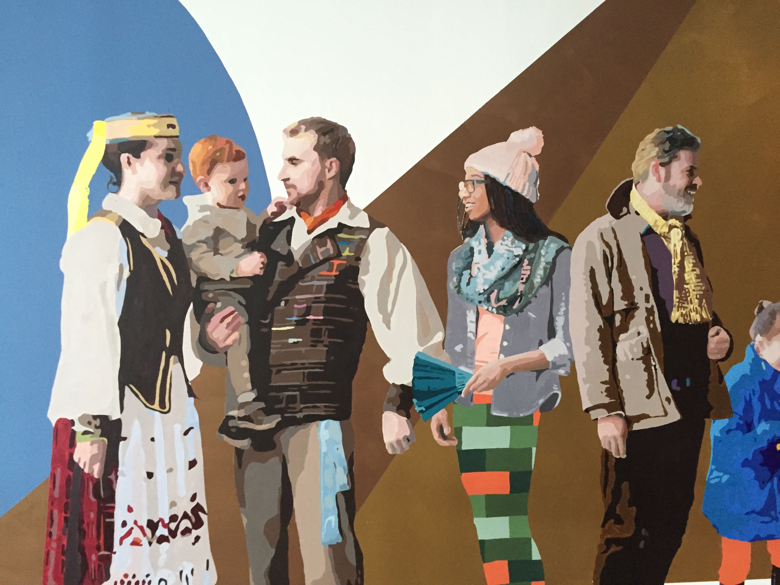 Mural section showing a group of adults and a child in varied colorful dress before large blue, gold, and brown geometric forms.
